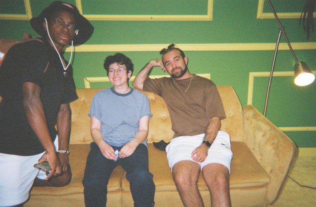 Picture of me and my coworkers on a couch on set